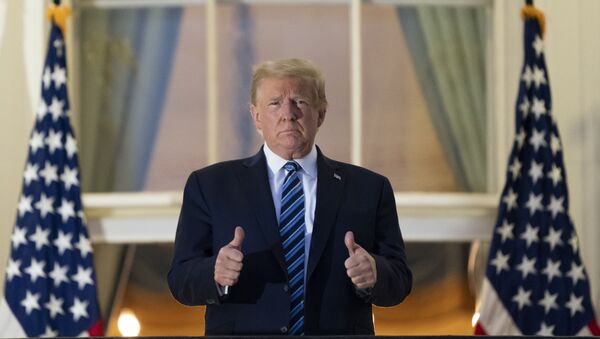 President Donald Trump gives thumbs up on the Blue Room Balcony upon returning to the White House Monday, Oct. 5, 2020, in Washington, after leaving Walter Reed National Military Medical Center, in Bethesda, Md. - Sputnik International
