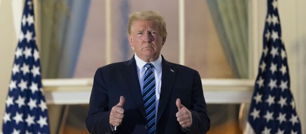 President Donald Trump gives thumbs up on the Blue Room Balcony upon returning to the White House Monday, Oct. 5, 2020, in Washington, after leaving Walter Reed National Military Medical Center, in Bethesda, Md. - Sputnik International