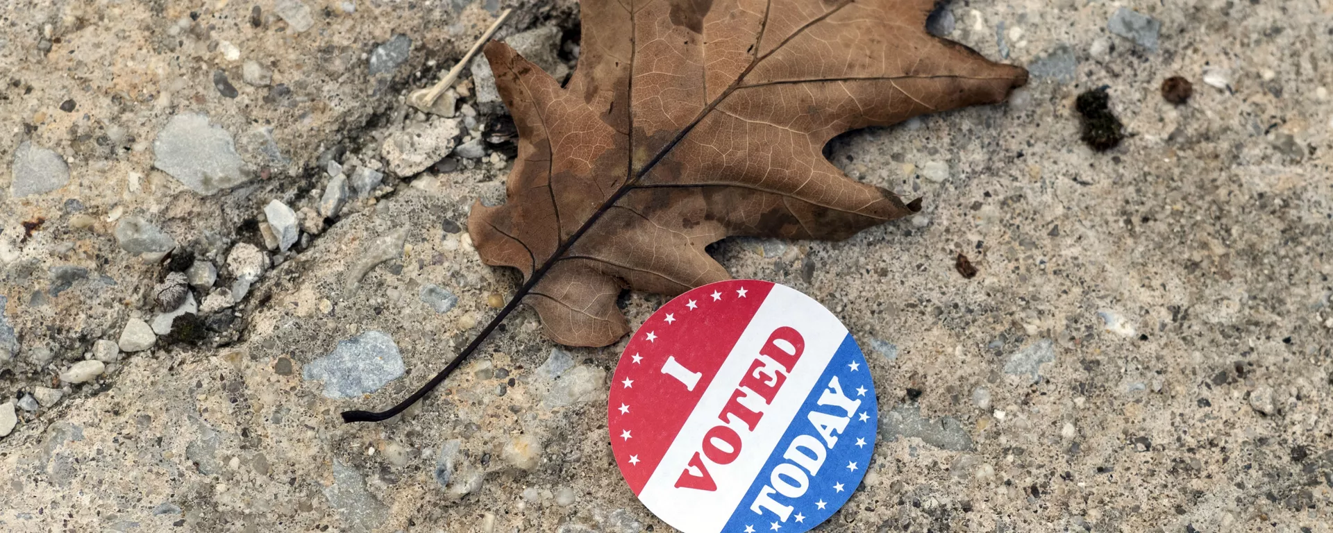 A discarded voting sticker lies on the ground at a satellite election office at Overbrook High School on Thursday, Oct. 1, 2020, in Philadelphia. The city of Philadelphia has opened several satellite election offices and more are slated to open in the coming weeks where voters can drop off their mail in ballots before Election Day.  - Sputnik International, 1920, 22.07.2023