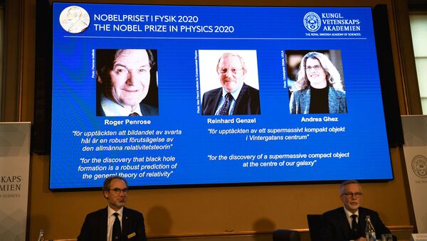 David Haviland, member of the Nobel Committee for Physics and Secretary General of the Royal Swedish Academy of Sciences Goran K. Hansson announce the winners of the 2020 Nobel Prize in Physics presented on the screen: Roger Penrose, Reinhard Genzel and Andrea Ghez during a news conference at the Royal Swedish Academy of Sciences, in Stockholm, Sweden October 6, 2020 - Sputnik International
