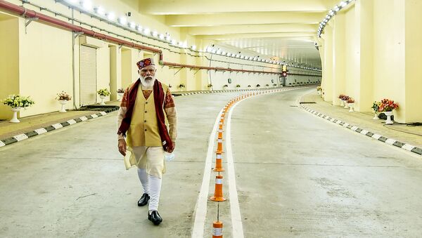In this handout photograph taken on October 3, 2020 and released by the Indian Press Information Bureau (PIB), India's Prime Minister Narendra Modi walks on a road inside the Highway Atal tunnel, near Manali in Himachal Pradesh state. - Sputnik International