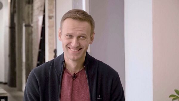 Russian opposition politician Alexei Navalny smiles during an interview with prominent Russian YouTube blogger Yury Dud, in Berlin, Germany, in this still image taken from a handout video released October 6, 2020 - Sputnik International