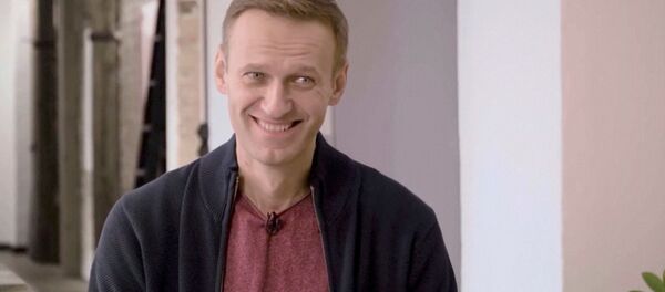 Russian opposition politician Alexei Navalny smiles during an interview with prominent Russian YouTube blogger Yury Dud, in Berlin, Germany, in this still image taken from a handout video released October 6, 2020 - Sputnik International