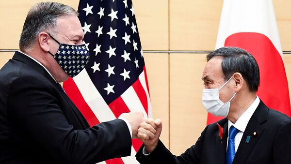 Japan's Prime Minister Yoshihide Suga and U.S. Secretary of State Mike Pompeo greet prior to their meeting at the prime minister's office in Tokyo, Japan October 6, 2020 - Sputnik International