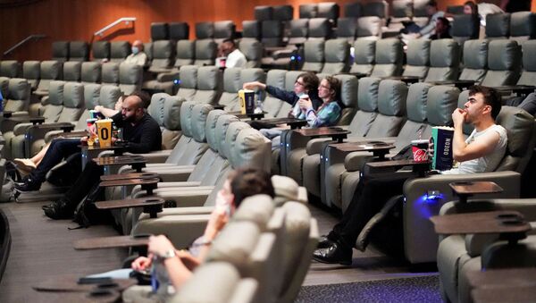  People take their seats inside the Odeon Luxe Leicester Square cinema, on the opening day of the film Tenet, amid the coronavirus disease (COVID-19) outbreak, in London, Britain, August 26, 2020 - Sputnik International