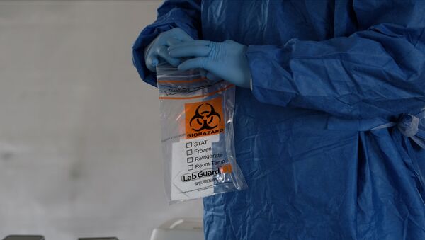 A biohazard bag is used for containing a specimen for a coronavirus disease (COVID-19) test - Sputnik International