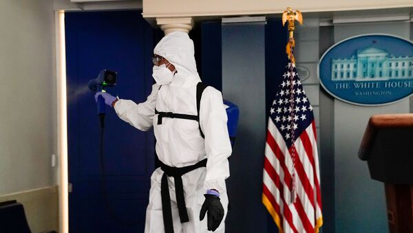 A member of the White House cleaning staff sprays the press briefing room the evening of U.S. President Donald Trump's return from Walter Reed Medical Center after contracting the coronavirus disease (COVID-19), in Washington, U.S., October 5, 2020. - Sputnik International