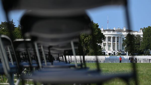 Empty chairs representing a fraction of the 200,000 U.S. lives lost to coronavirus disease (COVID-19) are seen during the National COVID-19 Remembrance near the White House in Washington, U.S. October 4, 2020. - Sputnik International
