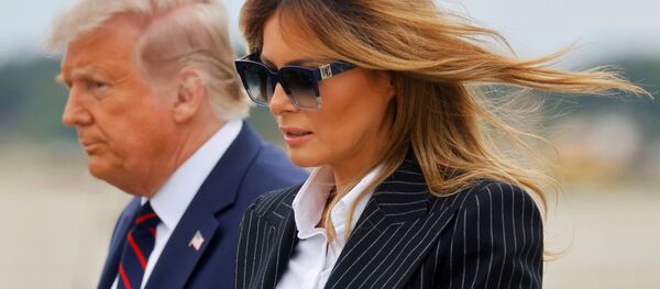 U.S. President Donald Trump walks with first lady Melania Trump at Cleveland Hopkins International Airport in Cleveland, Ohio, U.S., September 29, 2020. Picture taken September 29, 2020 - Sputnik International