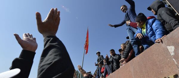 People protest during a rally on the central square in Bishkek, Kyrgyzstan, Wednesday, Oct. 7, 2020. Officials in Kyrgyzstan have nullified the results of a weekend parliamentary election after mass protests erupted in the capital of Bishkek and other cities, with opposition supporters seizing government buildings and demanding a new vote. - Sputnik International