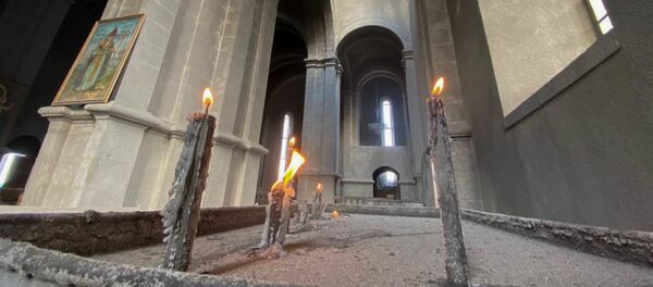 Candles are lit in the damaged Holy Savior Cathedral after the recent shelling, in Shusha, the self-proclaimed Nagorno-Karabakh Republic. A fresh spark in the conflict between Armenia and Azerbaijan in the disputed Nagorno-Karabakh region occurred on September, 27. Yerevan and Baku have both accused each other of violating the 1994 ceasefire and causing civilian casualties. - Sputnik International