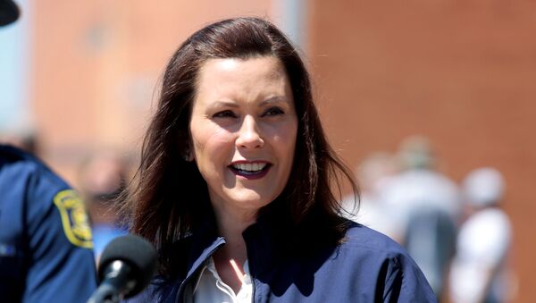 Michigan Governor Gretchen Whitmer addresses the media about the flooding along the Tittabawassee River, after several dams breached, in downtown Midland, Michigan, U.S., May 20, 2020. REUTERS/Rebecca Cook - Sputnik International