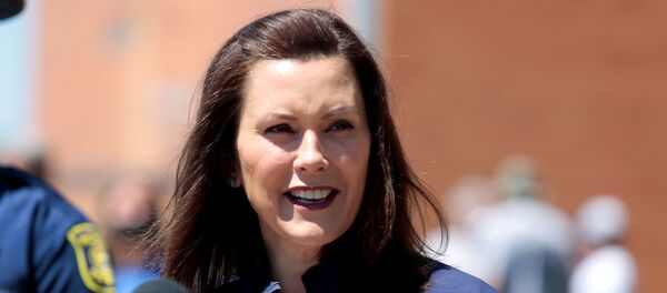 Michigan Governor Gretchen Whitmer addresses the media about the flooding along the Tittabawassee River, after several dams breached, in downtown Midland, Michigan, U.S., May 20, 2020. REUTERS/Rebecca Cook Michigan Governor Gretchen Whitmer addresses the media about the flooding along the Tittabawassee River, after several dams breached, in downtown Midland, Michigan, U.S., May 20, 2020. REUTERS/Rebecca Cook - Sputnik International