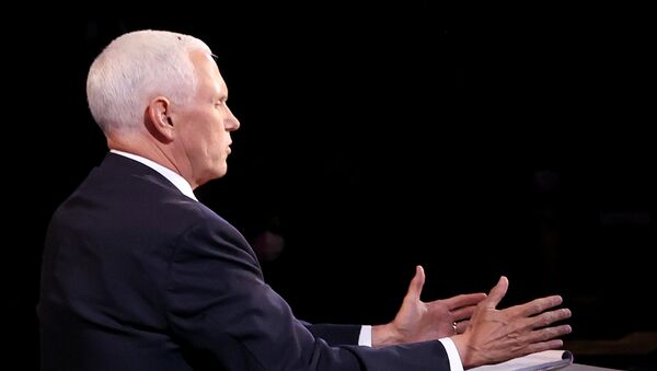 A fly is seen on the head of U.S. Vice President Mike Pence as he takes part in the 2020 vice presidential debate with the Democratic vice presidential nominee and U.S. Senator Kamala Harris (not pictured) on the campus of the University of Utah in Salt Lake City, Utah, U.S., October 7, 2020 - Sputnik International