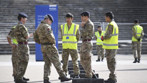 British Army soldiers get instructions outside the ExCel center which is being turned in to a 4000 bed temporary hospital for coronavirus patients in London, Tuesday, March 31, 2020. - Sputnik International