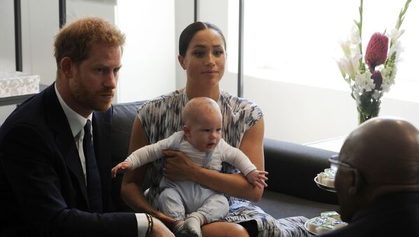 Britain's Prince Harry and Meghan, Duchess of Sussex, holding their son Archie, meet with Anglican Archbishop Emeritus, Desmond Tutu in Cape Town, South Africa, Wednesday Sept. 25, 2019. - Sputnik International