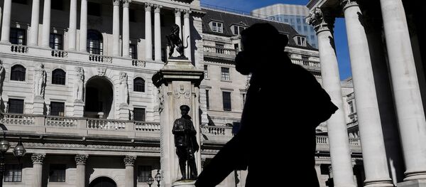 A person wearing a mask walks past the Bank of England in London, Britain, March 23, 2020 A person wearing a mask walks past the Bank of England in London, Britain, March 23, 2020 - Sputnik International