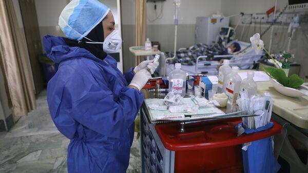 In this Tuesday, June 16, 2020, photo, a nurse prepares medicines for COVID-19 patients at the Shohadaye Tajrish Hospital in Tehran, Iran. After months of fighting the coronavirus, Iran only just saw its highest single-day spike in reported cases after Eid al-Fitr, the holiday that celebrates the end of Ramadan.  - Sputnik International