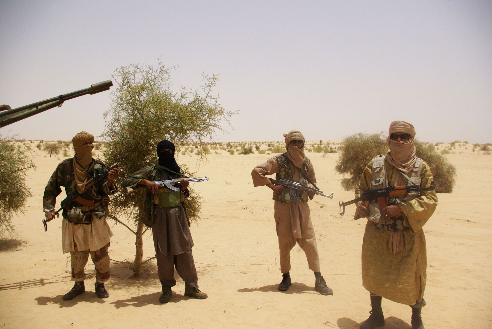 In this Tuesday, April 24, 2012 file photo, fighters from Islamist group Ansar Dine stand guard during a hostage handover, in the desert outside Timbuktu, Mali.   - Sputnik International, 1920, 31.12.2021