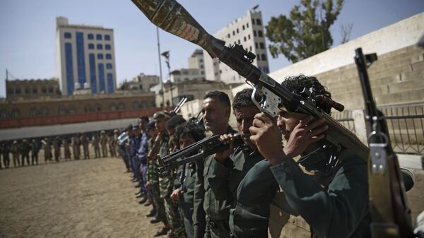 Houthi rebel fighters display their weapons during a gathering aimed at mobilizing more fighters for the Iranian-backed Houthi movement, in Sanaa, Yemen, Thursday, Feb. 20, 2020. The Houthi rebels control the capital, Sanaa, and much of the country’s north, where most of the population lives. They are at war with a U.S.-backed, Saudi-led coalition fighting on behalf of the internationally recognized government. - Sputnik International