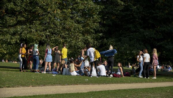A group of people gather in Hyde Park, in London, Sunday, Sept. 13, 2020. From Monday, social gatherings of more than six people will be banned in England — both indoors and outdoors — and Boris Johnson hinted that such restrictions will potentially remain in place until or through Christmas.  - Sputnik International