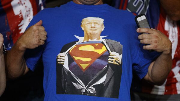 A supporter of President Donald Trump wears a t-shirt with the image of the president as Superman at a campaign rally at Williams Arena in Greenville, N.C., Wednesday, July 17, 2019.  - Sputnik International