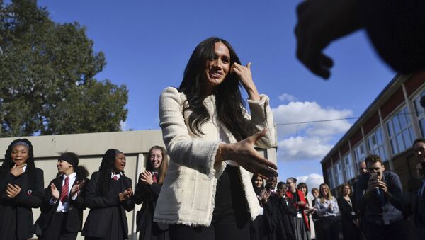 Britain's Meghan, Duchess of Sussex, is greeted by pupils at the Robert Clack Upper School in Dagenham, Essex, in eastern London, during a surprise visit to celebrate International Women's Day, Friday, March 6, 2020 - Sputnik International