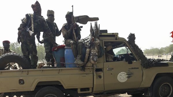 Soldiers of the Chad Army sit on the back of a Land Cruiser at the Koundoul market, 25 km from N'Djamena, on January 3, 2020, upon their return  after a months-long mission fighting Boko Haram in neighbouring Nigeria.  - Sputnik International