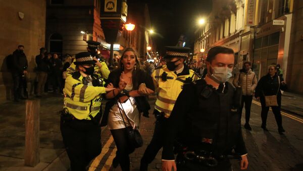 Police patrol as revellers enjoy a night out in the centre of Liverpool, north west England on October 10, 2020 ahead of new measures set to be introduced in the northwest next week to help stem the spread of the novel coronavirus - Sputnik International