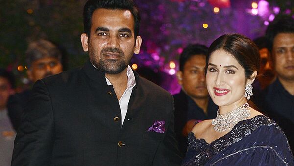 Indian Cricketer Zaheer Khan poses for a picture with his wife and actress Sagarika Ghatge as they attend the pre-engagement party of India's richest man and Reliance Industries Limited Chairman, Mukesh Ambani’s eldest son Akash Ambani and fiancee Shloka Mehta, in Mumbai late on June 30, 2018 - Sputnik International