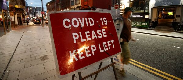 A man walks past a sign in Liverpool City Centre as Merseyside remains under lockdown due to the coronavirus disease (COVID-19) outbreak, in Liverpool, Britain, 22 September 2020 A man walks past a sign in Liverpool City Centre as Merseyside remains under lockdown due to the coronavirus disease (COVID-19) outbreak, in Liverpool, Britain, 22 September 2020 - Sputnik International