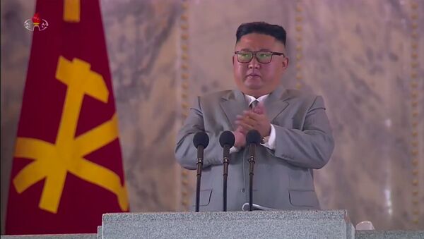 A screen grab taken from a KCNA broadcast on 10 October 2020 shows North Korean leader Kim Jong Un addressing attendees of a military parade on Kim Il Sung square in Pyongyang. - Sputnik International