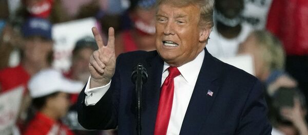President Donald Trump speaks at a campaign rally at the Orlando Sanford International Airport Monday, Oct. 12, 2020, in Sanford, Fla. President Donald Trump speaks at a campaign rally at the Orlando Sanford International Airport Monday, Oct. 12, 2020, in Sanford, Fla. - Sputnik International
