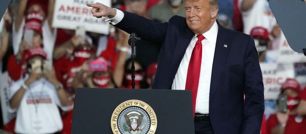 President Donald Trump arrives at a campaign rally at the Orlando Sanford International Airport Monday, Oct. 12, 2020, in Sanford, Fla. - Sputnik International
