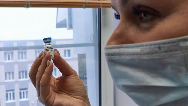 A health worker holds the Russian coronavirus vaccine Gam-COVID-Vac, trade-named Sputnik V, developed by the Gamaleya Scientific Research Institute of Epidemiology and Microbiology during the vaccination of medical workers, in Sestroretsk, Leningrad region, Russia - Sputnik International