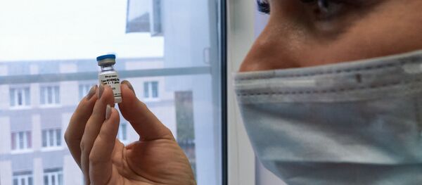 A health worker holds the Russian coronavirus vaccine Gam-COVID-Vac, trade-named Sputnik V, developed by the Gamaleya Scientific Research Institute of Epidemiology and Microbiology during the vaccination of medical workers, in Sestroretsk, Leningrad region, Russia A health worker holds the Russian coronavirus vaccine Gam-COVID-Vac, trade-named Sputnik V, developed by the Gamaleya Scientific Research Institute of Epidemiology and Microbiology during the vaccination of medical workers, in Sestroretsk, Leningrad region, Russia - Sputnik International