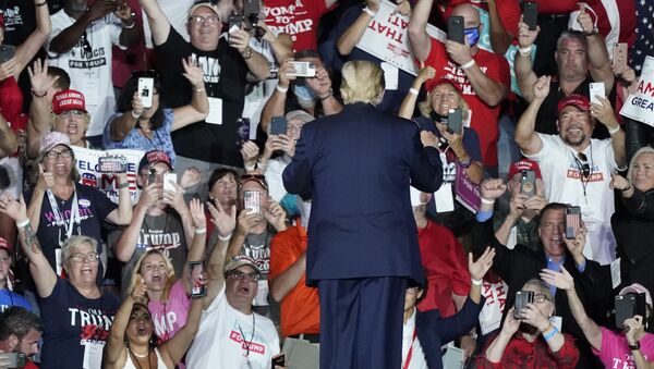 Supporters cheer as President Donald Trump leaves a campaign rally at Orlando Sanford International Airport Monday, 12 October 2020, in Sanford, Florida. - Sputnik International