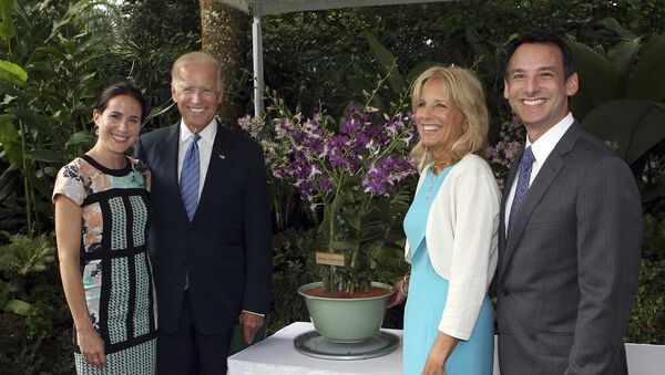 U.S. Vice President Joe Biden, second left, smiles with his wife, Jill, second right, their daughter Ashley, left, and their son-in-law Howard Krein as they stand by a newly unveiled orchid hybrid, the Dendrobium Joe and Jill Biden, named after in honor of the couple during a ceremony at the National Orchid Garden in Singapore Friday, July 26, 2013. - Sputnik International