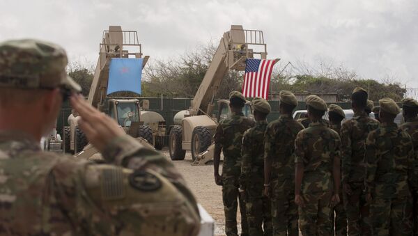 Somali national army soldiers stand in formation during a logistics course graduation ceremony. Soldiers from Somali’s advanced infantry DANAB battalion spent 14 weeks training with the U.S. 10th Mountain division on the importance of logistical operation as well as the operation and maintenance of heavy equipment. - Sputnik International