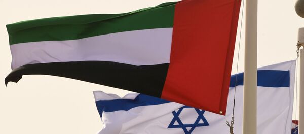 The Emirati, Israeli and US flags sway in the wind at the Abu Dhabi airport at the arrival of the first-ever commercial flight from Israel to the UAE, on August 31, 2020. The Emirati, Israeli and US flags sway in the wind at the Abu Dhabi airport at the arrival of the first-ever commercial flight from Israel to the UAE, on August 31, 2020. - Sputnik International