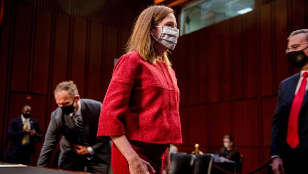 US Supreme Court nominee Judge Amy Coney Barrett departs at the end of the more than eleven hour-long second day of her nomination hearing before the US Senate Judiciary Committee on Capitol Hill in Washington, October 13, 2020 - Sputnik International