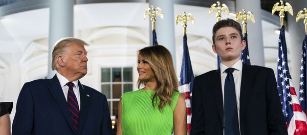  In this Aug. 27, 2020 file photo, Barron Trump right, stands with President Donald Trump and first lady Melania Trump on the South Lawn of the White House on the fourth day of the Republican National Convention in Washington. - Sputnik International