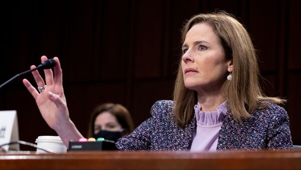 Judge Amy Coney Barrett tests her microphone after it failed several times during the third day of her Senate confirmation hearing to the Supreme Court on Capitol Hill in Washington, DC, U.S., October 14, 2020. - Sputnik International