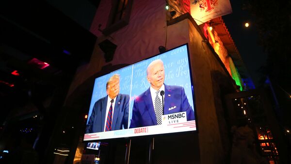 WEST HOLLYWOOD, CALIFORNIA - SEPTEMBER 29: A broadcast of the first debate between President Donald Trump and Democratic presidential nominee Joe Biden is played on a TV at The Abbey, which seated patrons at socially distanced outdoor tables, on September 29, 2020 in West Hollywood, California. - Sputnik International