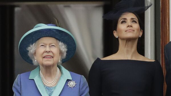 FILE - In this Tuesday, July 10, 2018 file photo Britain's Queen Elizabeth II and Meghan the Duchess of Sussex stand on a balcony to watch a flypast of Royal Air Force aircraft pass over Buckingham Palace in London - Sputnik International