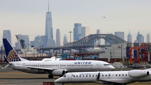 United Airlines passenger jets taxi with New York City as a backdrop, at Newark Liberty International Airport, New Jersey, U.S. December 6, 2019 - Sputnik International