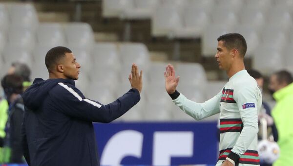 FILE - In this Sunday, Oct. 11, 2020 file photo France's Kylian Mbappe and Portugal's Cristiano Ronaldo, right, greet each other before the UEFA Nations League soccer match between France and Portugal at the Stade de France in Saint-Denis, north of Paris, France - Sputnik International