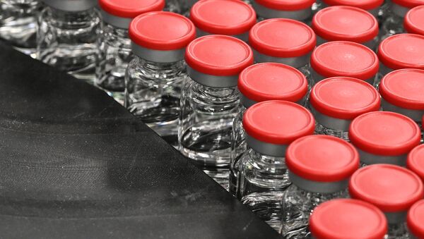 Capped vials are being pictured during filling and packaging tests for the large-scale production and supply of the University of Oxford’s COVID-19 vaccine candidate, AZD1222 - Sputnik International
