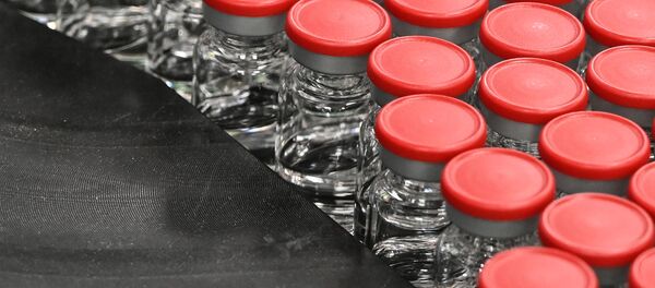 Capped vials are being pictured during filling and packaging tests for the large-scale production and supply of the University of Oxford’s COVID-19 vaccine candidate, AZD1222 - Sputnik International