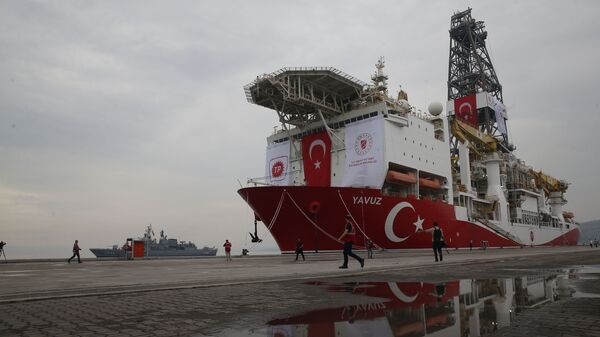 A Turkish Navy vessel patrols as the drilling ship 'Yavuz' to be dispatched to the Mediterranean, is docked at the port of Dilovasi, outside Istanbul,Thursday, June 20, 2019 - Sputnik International